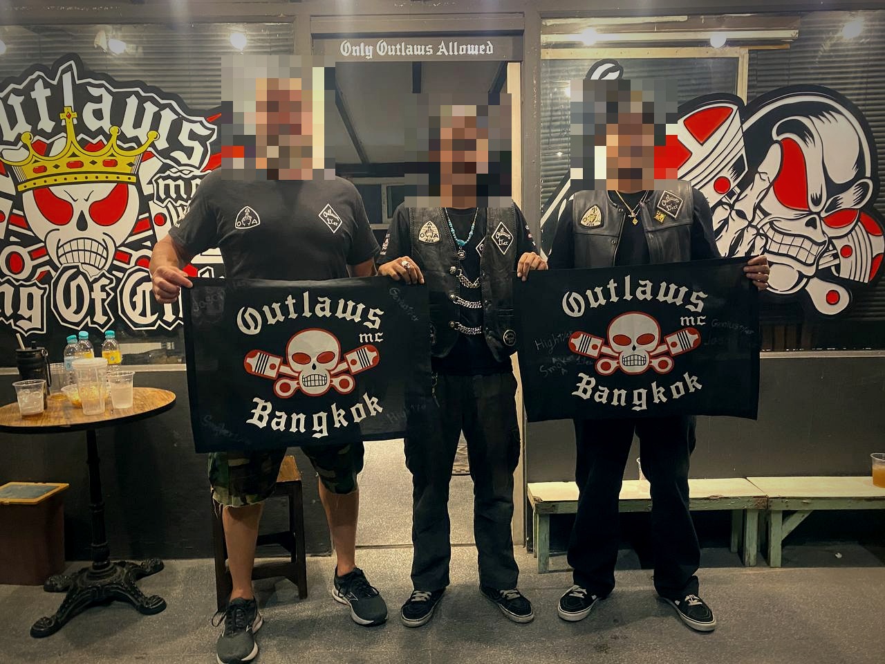 Smoker 1%er from Outlaws MC Bangkok presents a souvenir to our brothers from the Pathum Thani Chapter and Virginia, USA.
